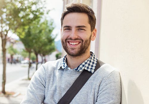 man outside smiling