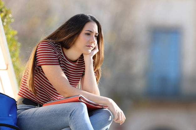 signs of opioid addiction (1) woman sitting outside wonder about signs of opioid addiction